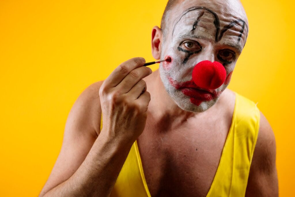 sad-clown-putting-on-makeup-GettyImages-2187826511.jpg