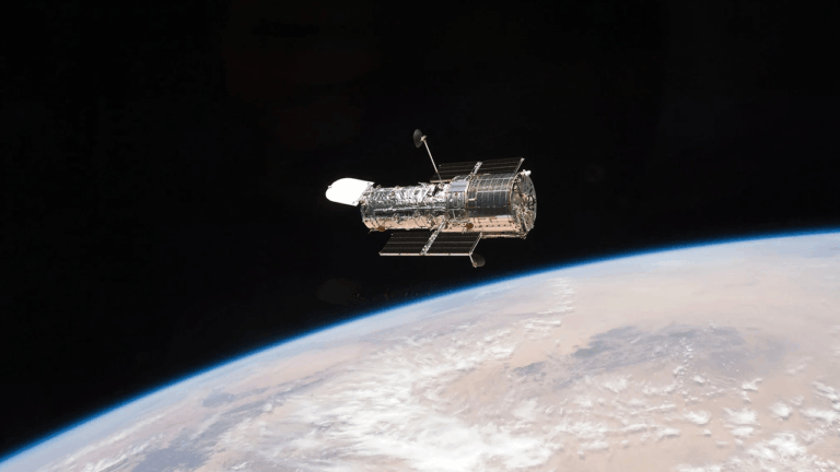 a-figure-eight-in-deep-space-hubble-image-shows-gravity-warping-distant-galaxies.png
